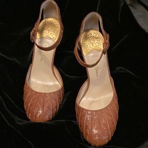 Brown leather pumps with Nike Air for comfort and style.